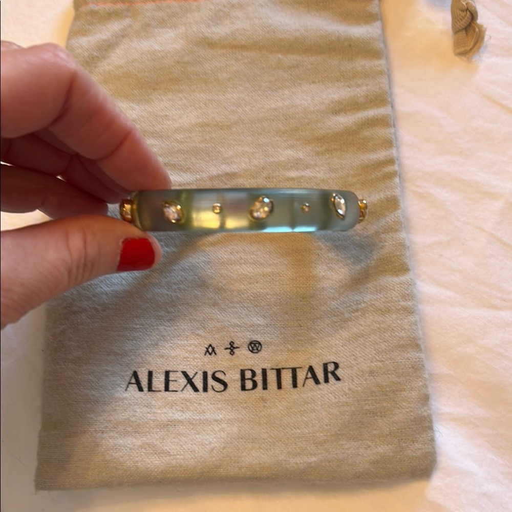Alexis Bittar light green lucite bangle bracelet with clear/gold accents